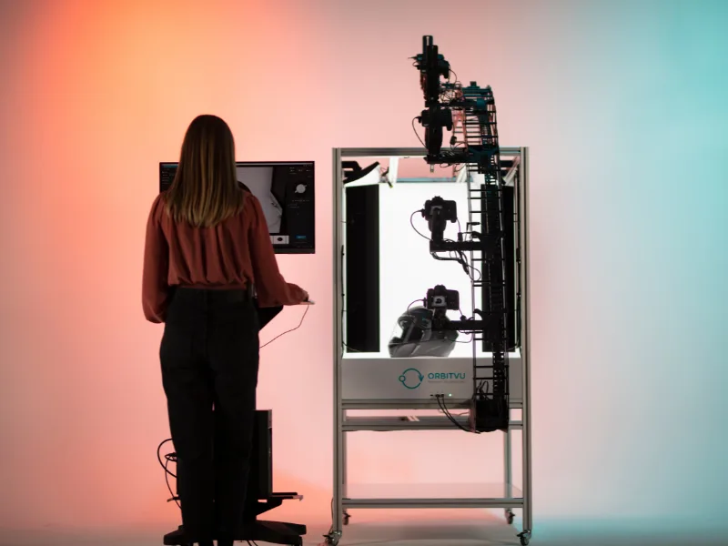 Operator using Alphashot XL v2 with 3D arm and multiple cameras to shoot a helmet