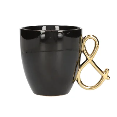 Black mug with gold ampersand handle