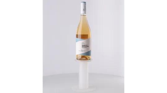 Bottle support holding a wine bottle upright for uniform lighting